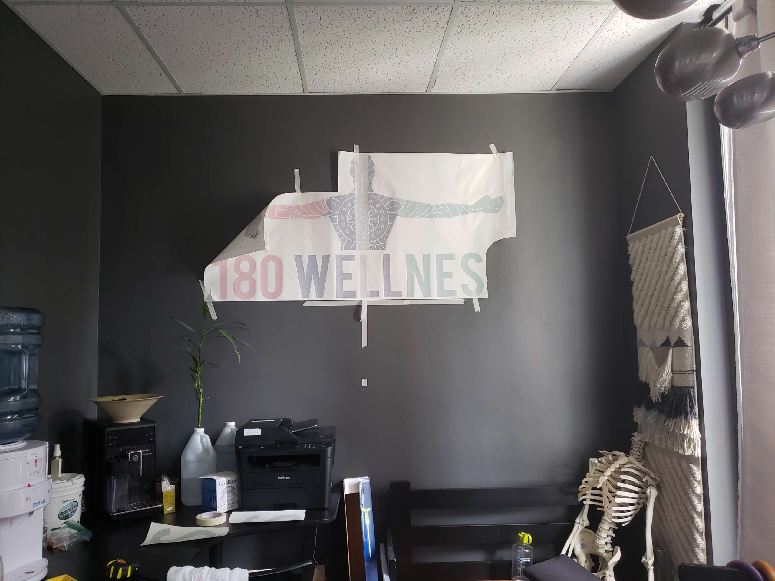 180 Wellness Clinic Installing Custom Wall Decal